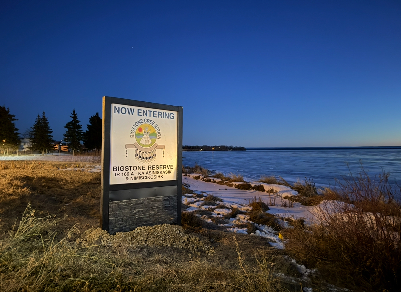 Bigstone Reserve IR 166A signage at twilight over the lake